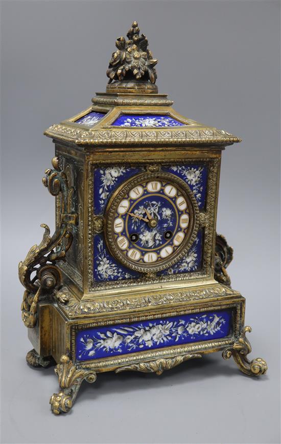 A French brass and porcelain mounted mantel clock, with keys height 34cm